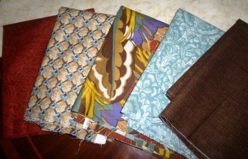 Material for Patchwork, different prints and fabrics.